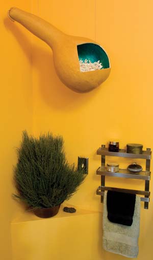 Nina's artistic bathroom incorporates many unique elements made of reused items--such as a cotton-swab holder fashioned from a dried gourd.